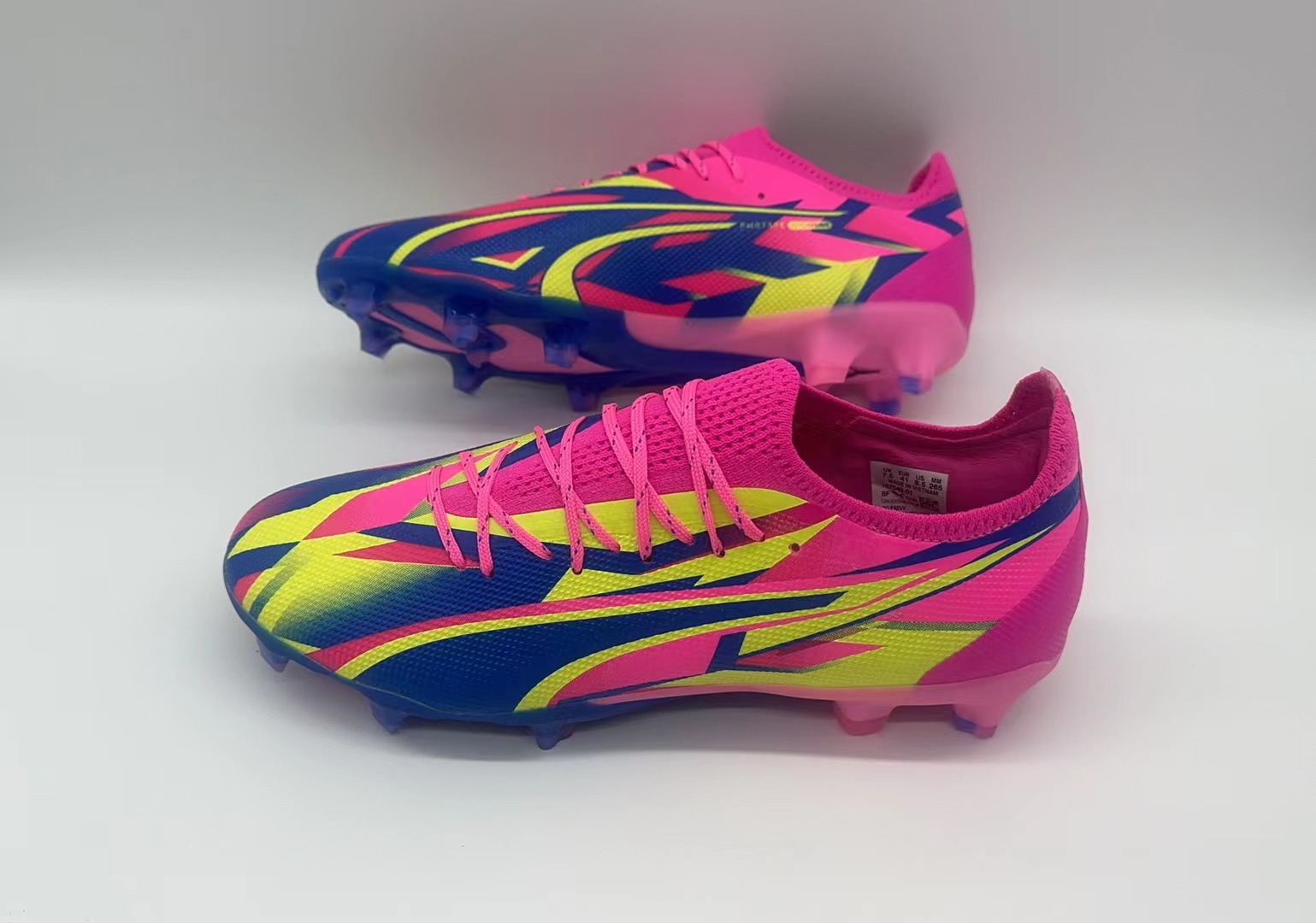 Rose red, blue and yellow football shoes