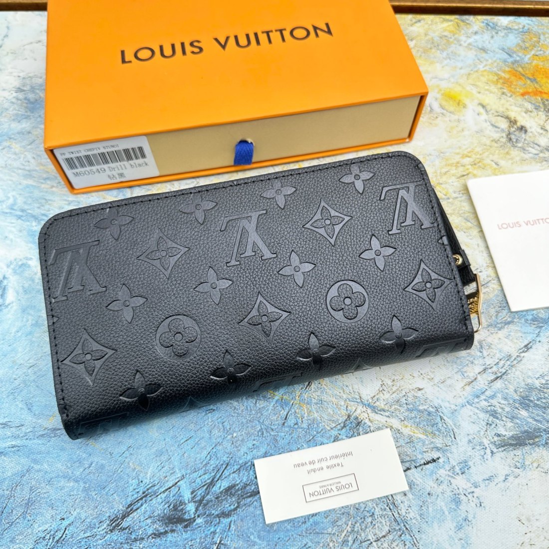 LV Zippy Embossed Cowhide Wallet