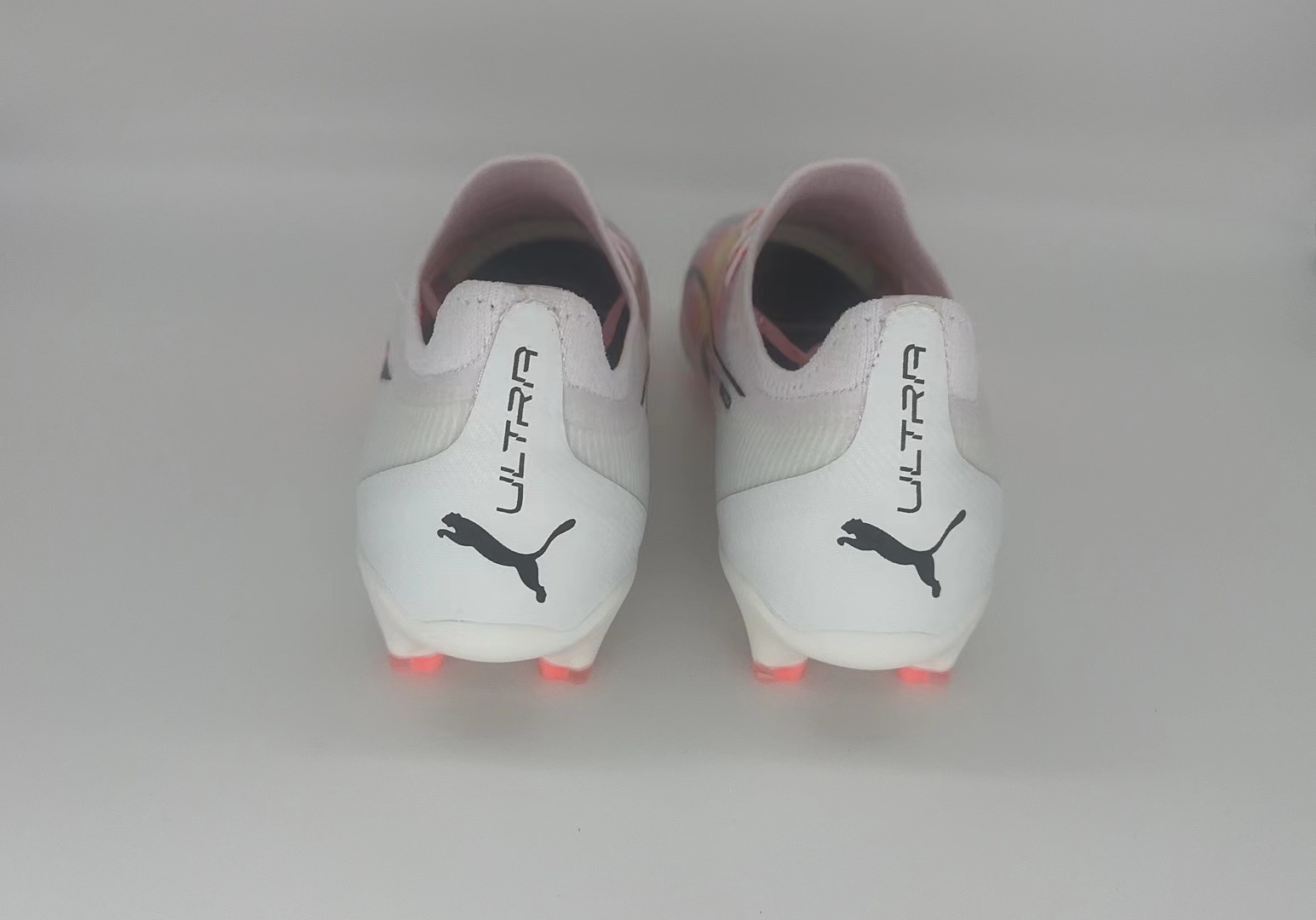 White orange football shoes