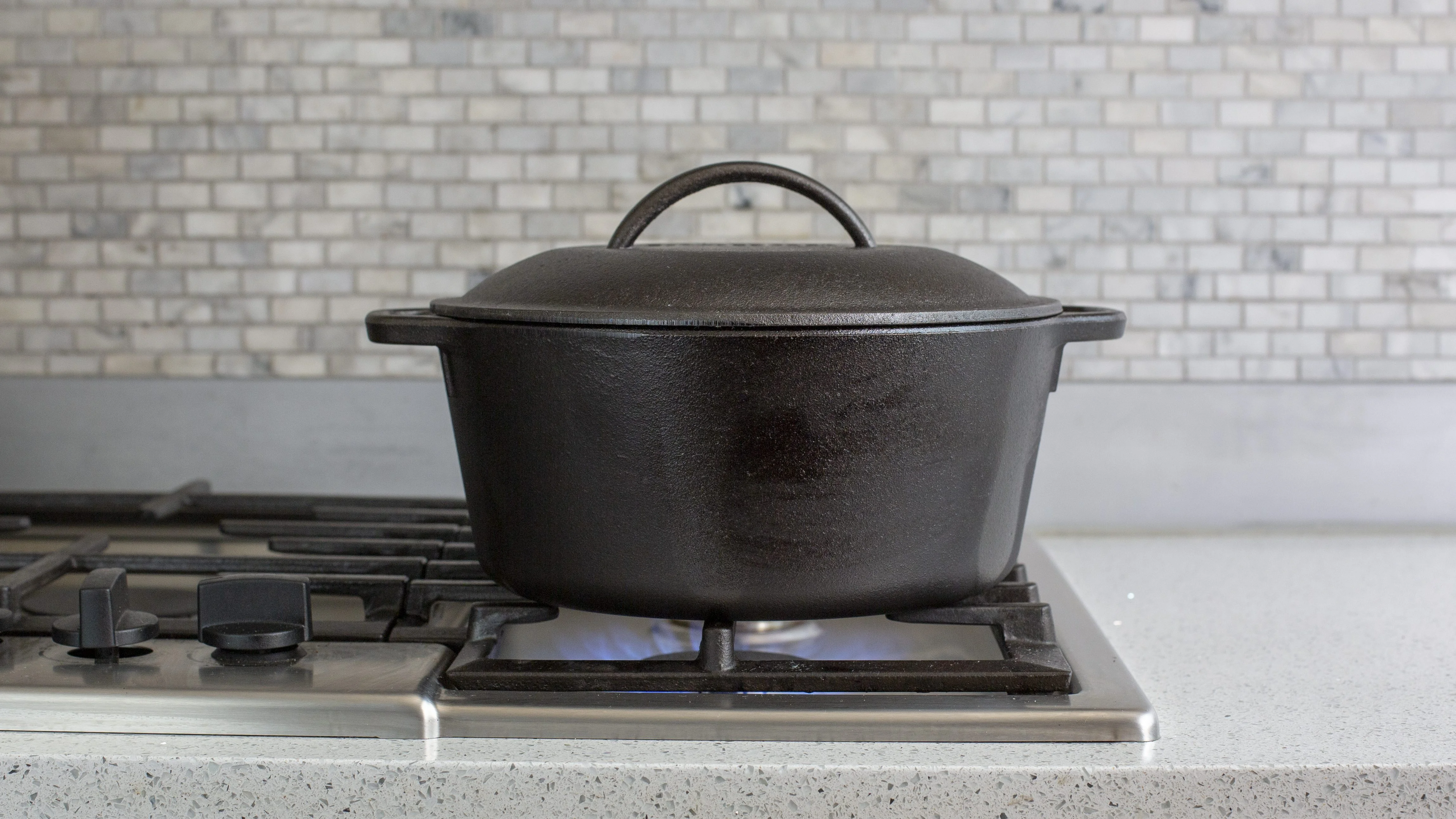 Lodge Pre-Seasoned 5 Quart Cast Iron Dutch Oven with Loop Handles and Cast Iron Cover