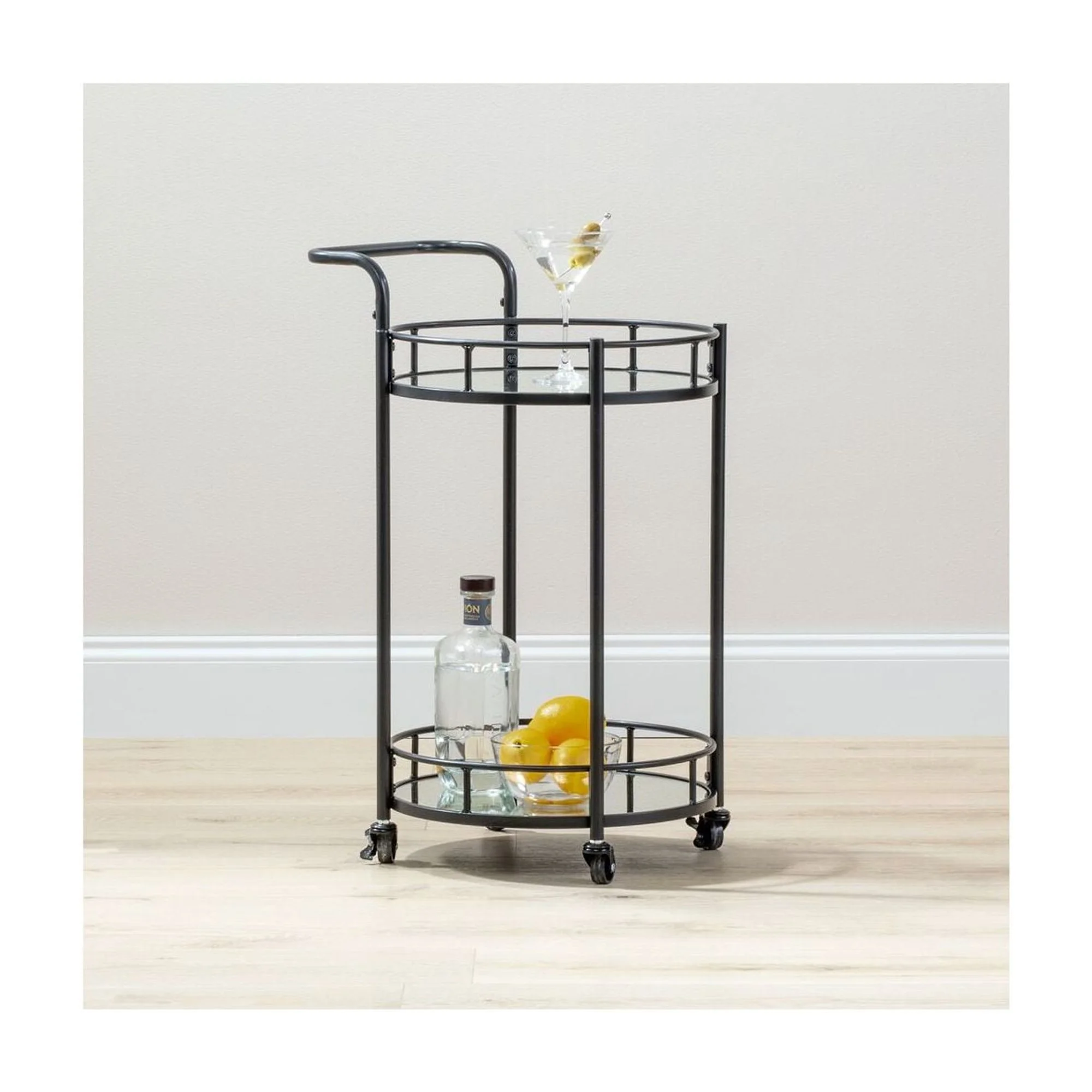 mDesign Metal Vintage Round Beverage Rolling Cart for Home - 2-Tier Serving Bar Trolley with Easy-Glide, Rotating Wheels, Built-in Handle, and Glass Shelves for Wine and Craft beverages - Black Round