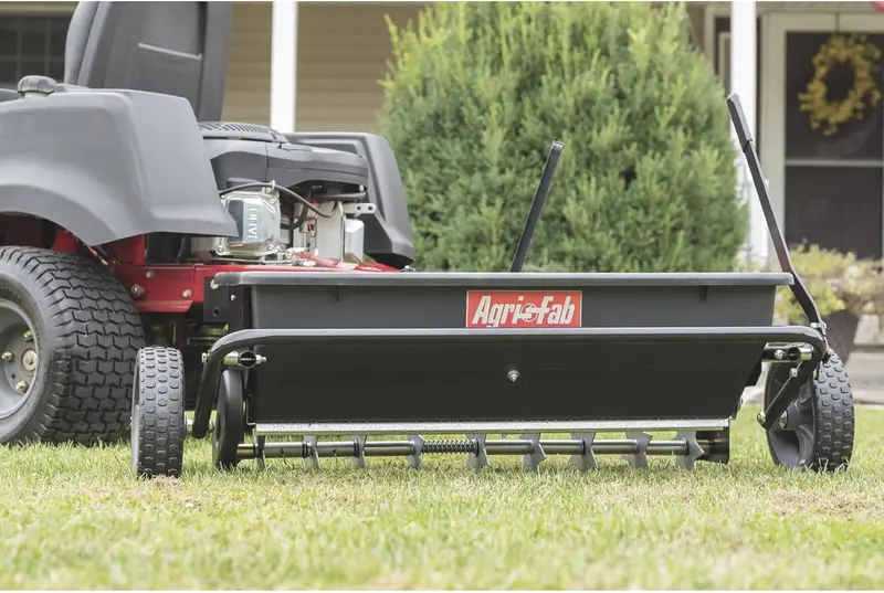 100-LB Traction-Drive Broadcast Seeder & Sprayer – Heavy-Duty Black Utility Spreader for Lawns and Fields