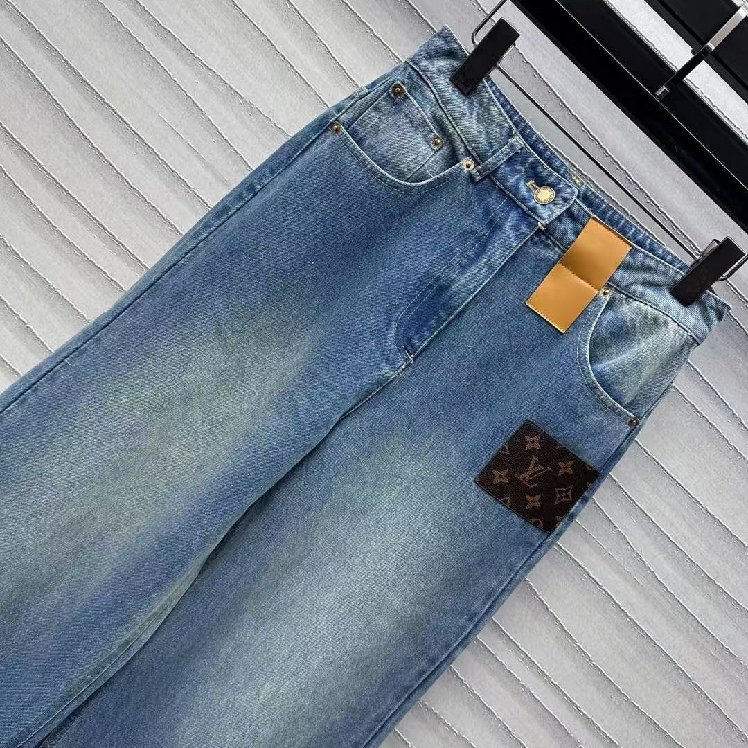 Leather brand denim trousers