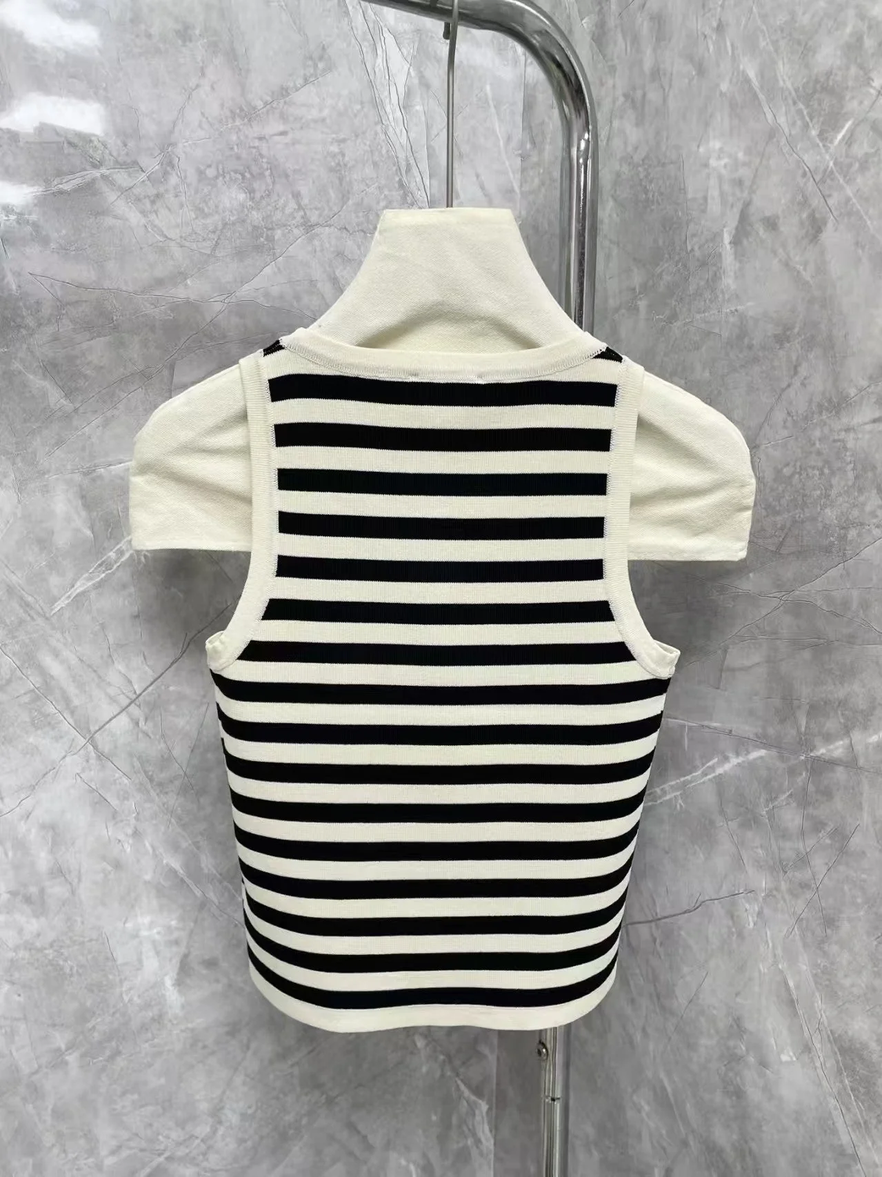 New contrast striped vest