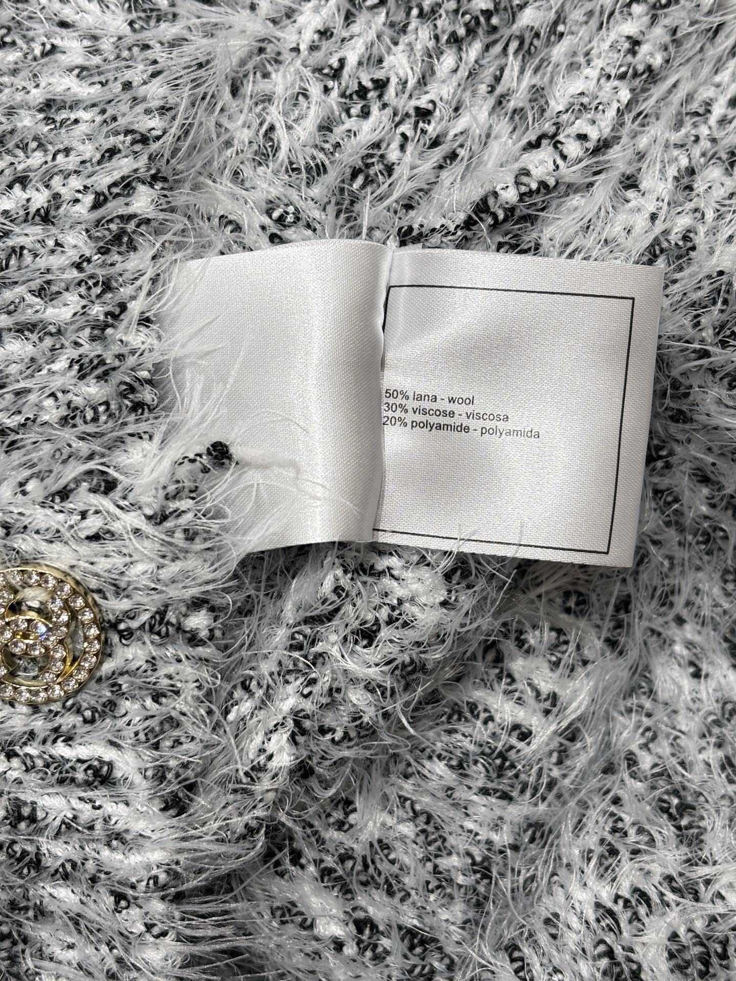 V-neck cardigan with logo and soft, casual knit.