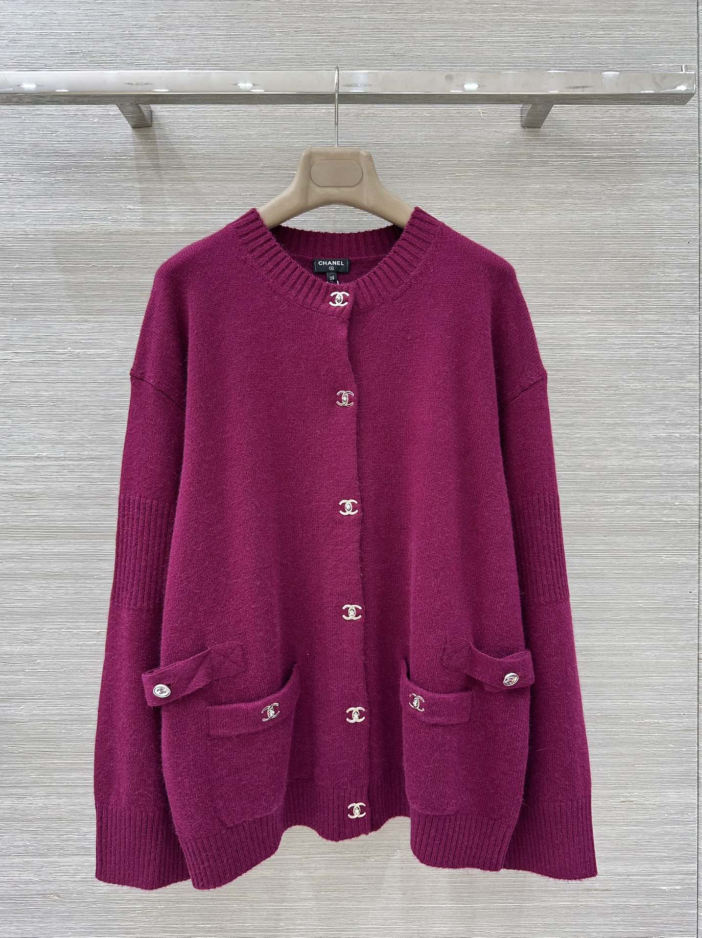 Long cardigan with round neck and backpack buckle