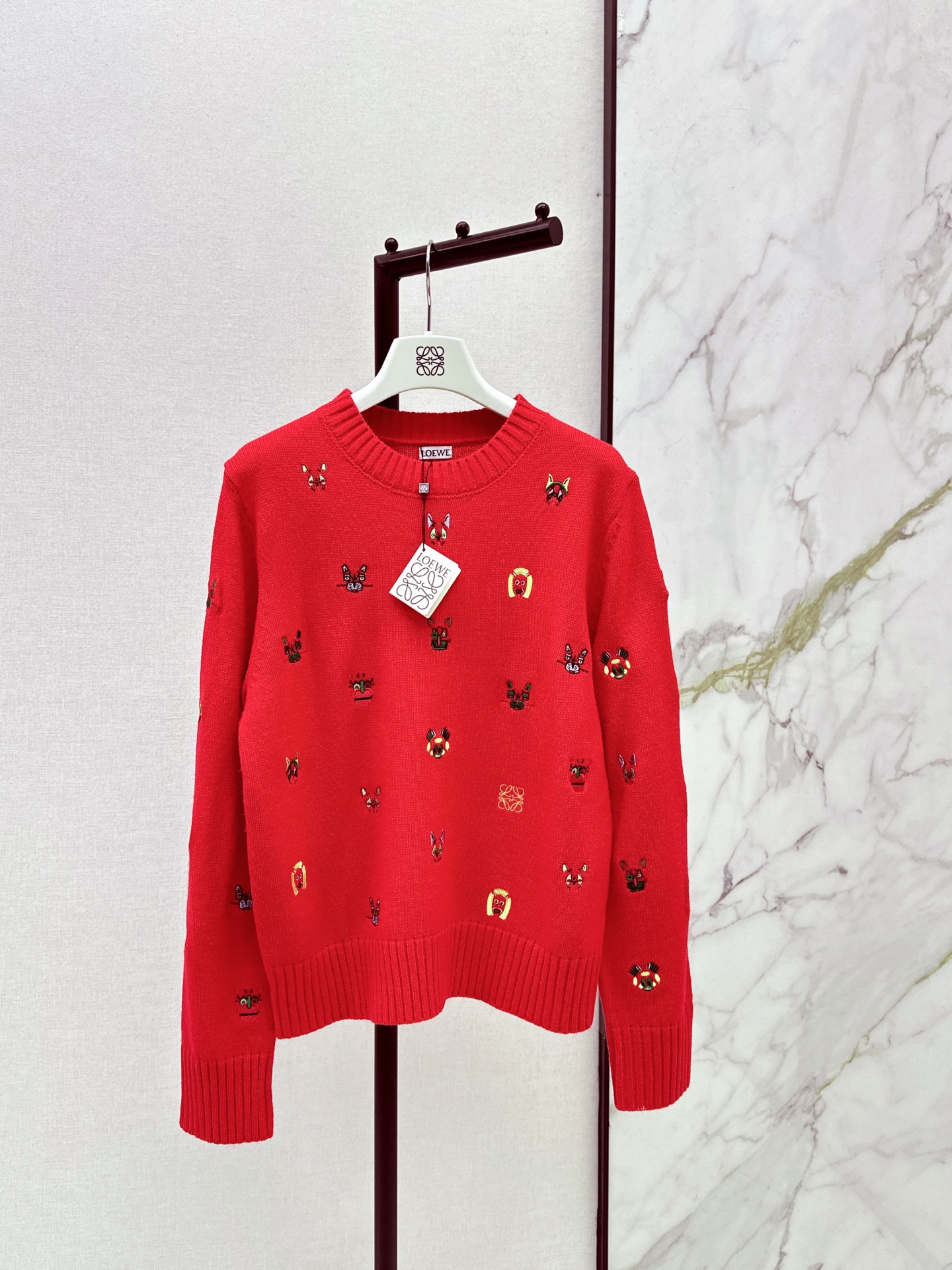 Patterned embroidered design, elegant round neck sweater