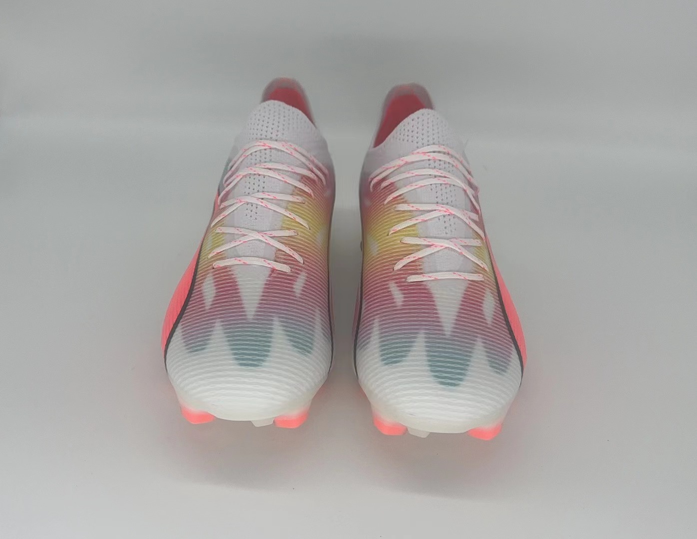 White orange football shoes