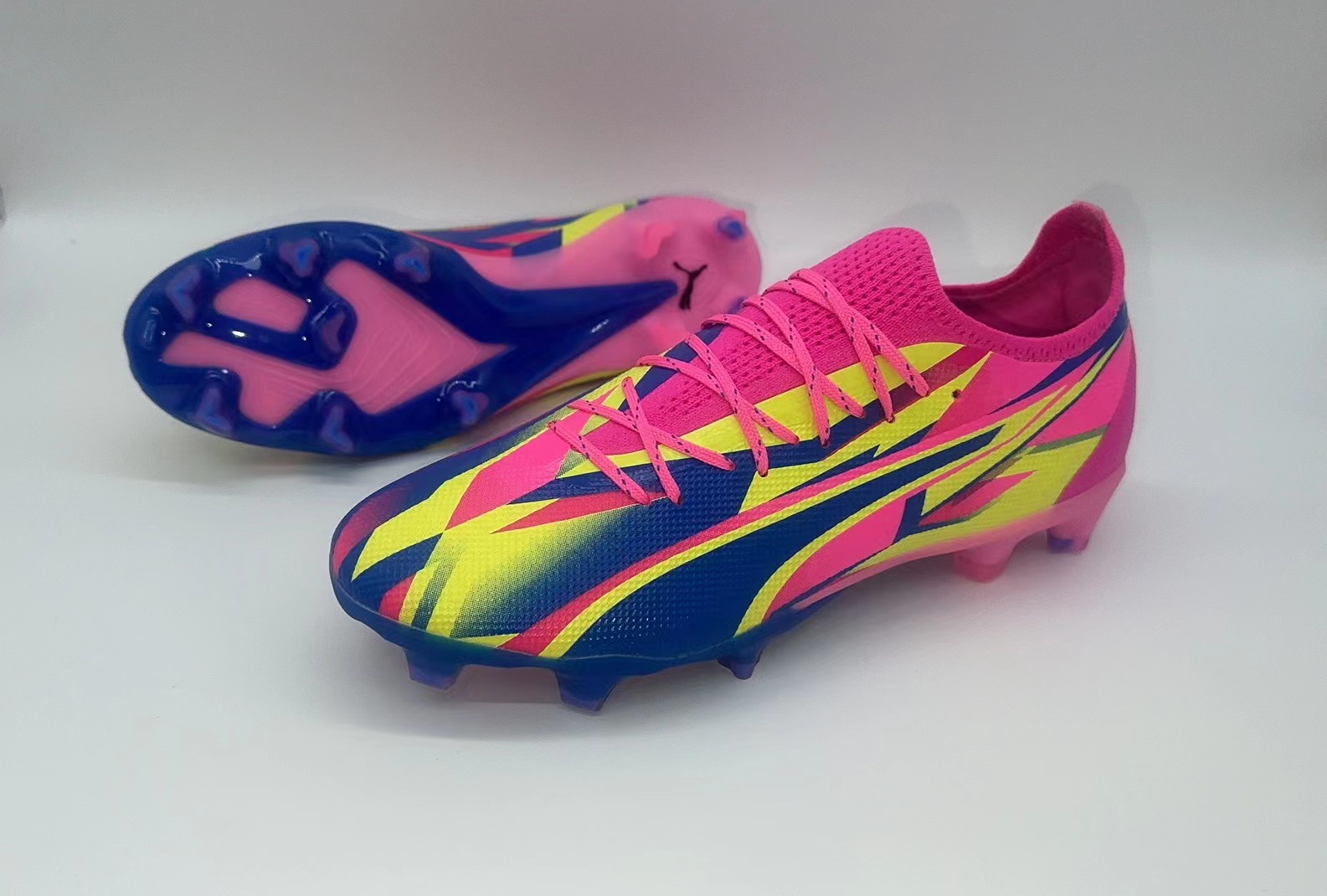 Rose red, blue and yellow football shoes