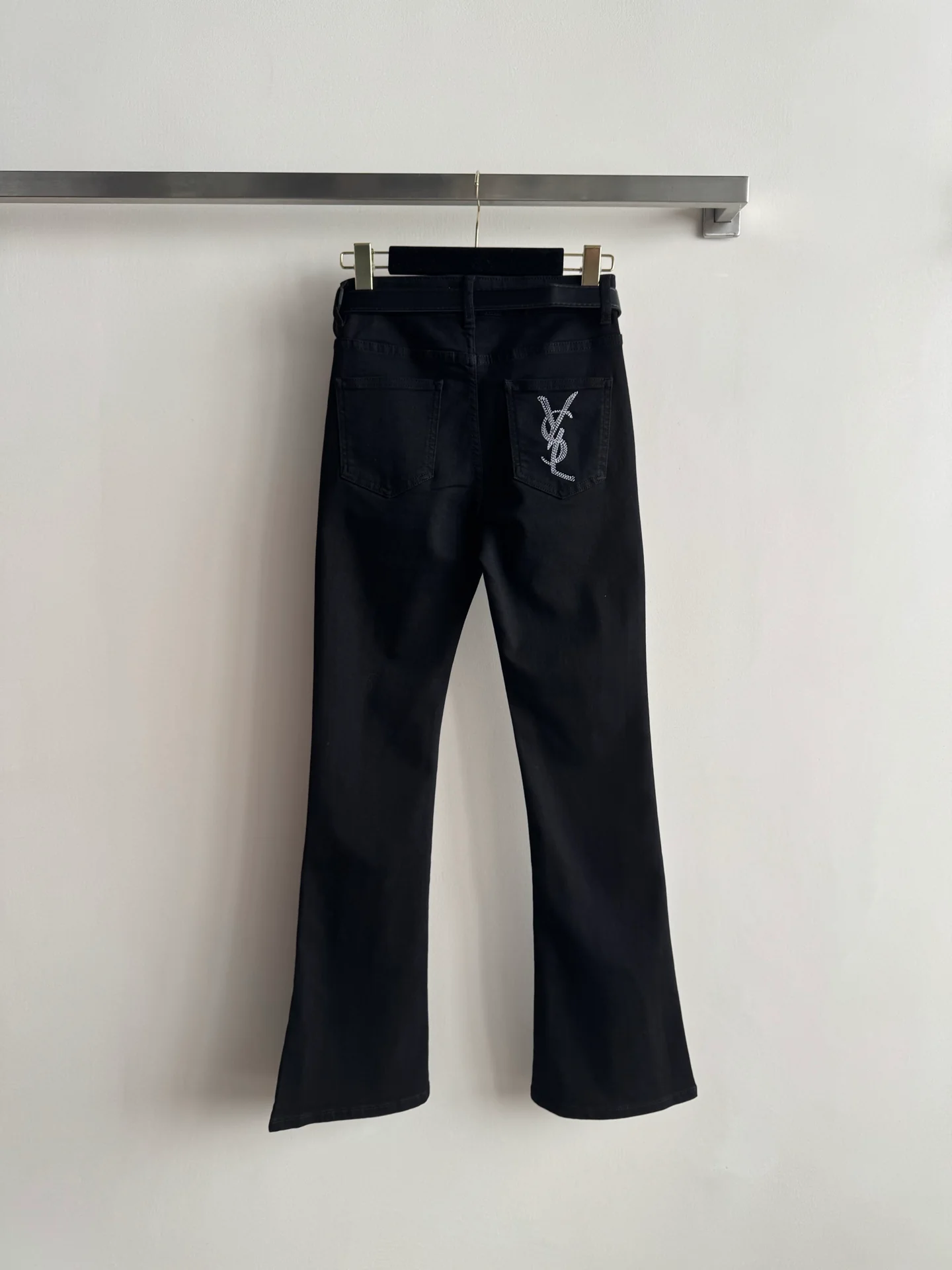 High-waisted embroidered flared pants.