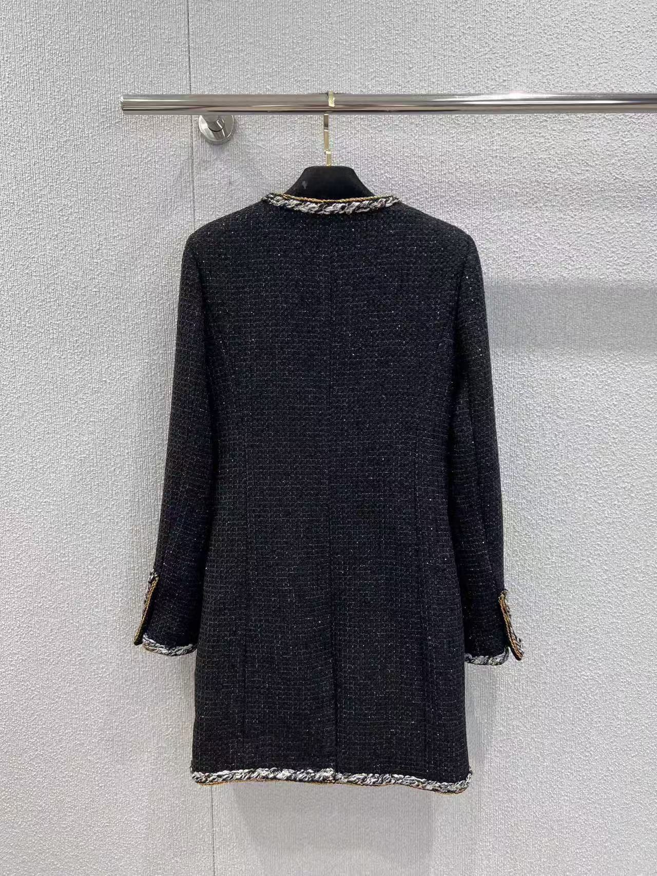 Black and gold four-pocket tweed jacket