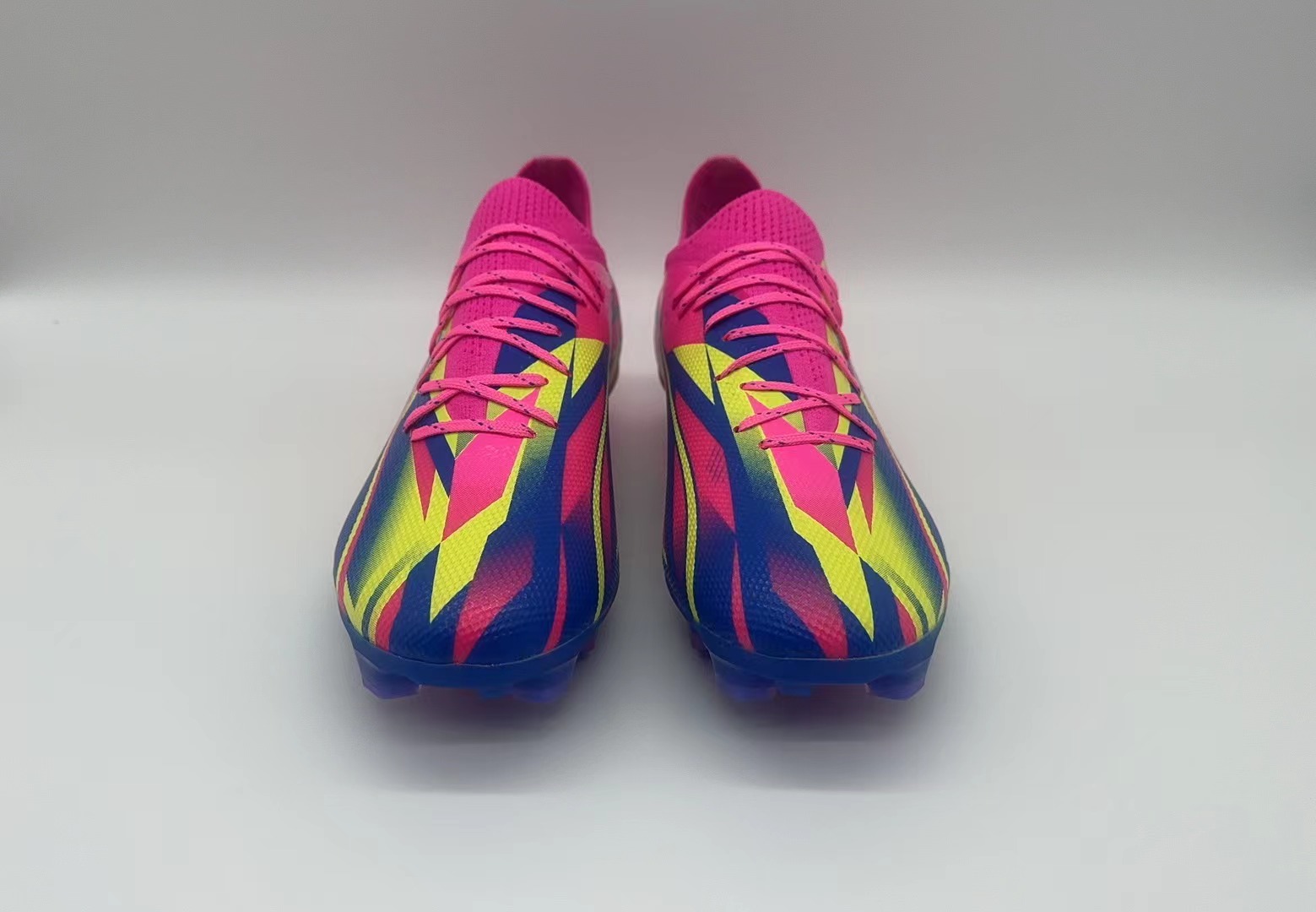 Rose red, blue and yellow football shoes