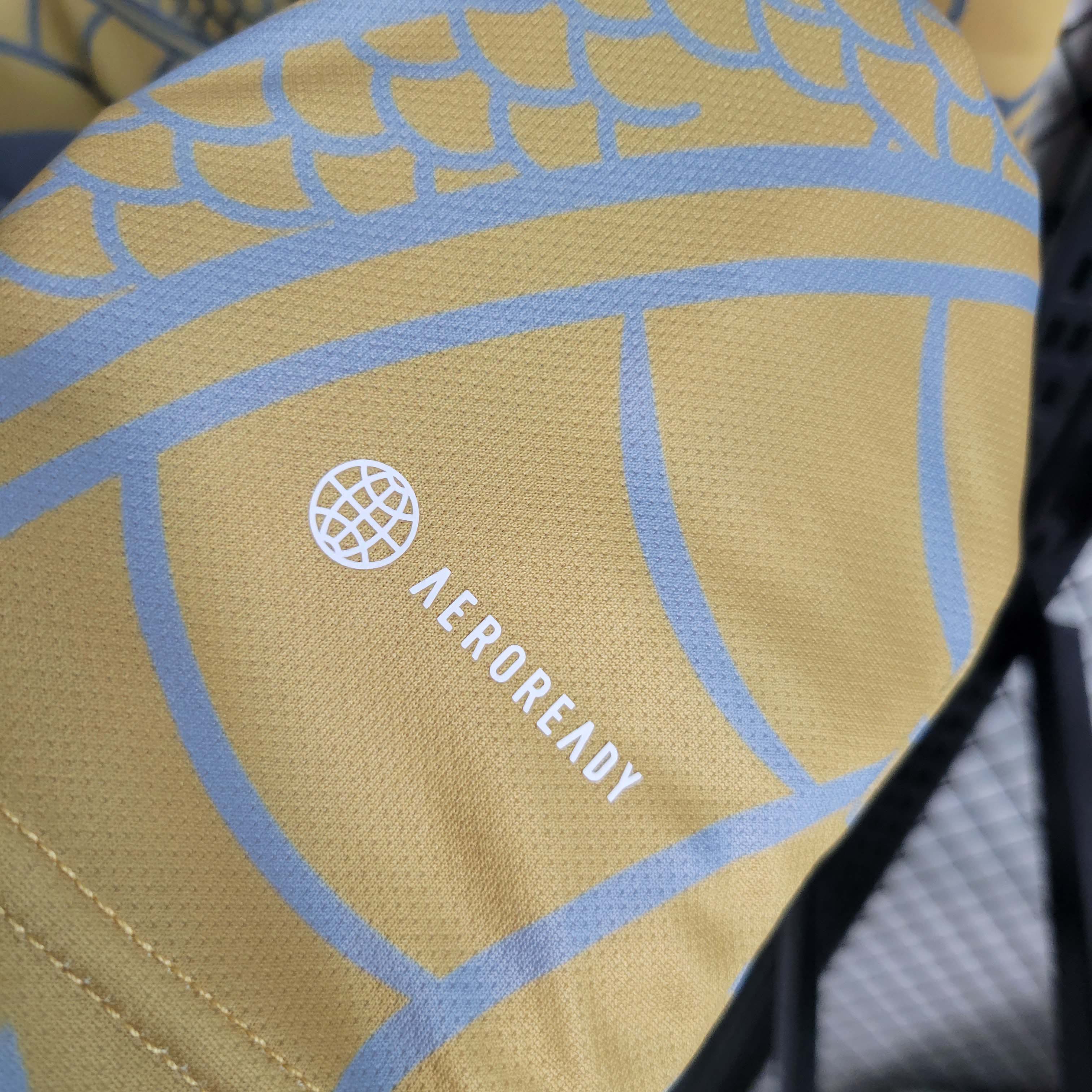 2023/2024 Real Madrid Chinese Gold Dragon Football Shirt-Fans