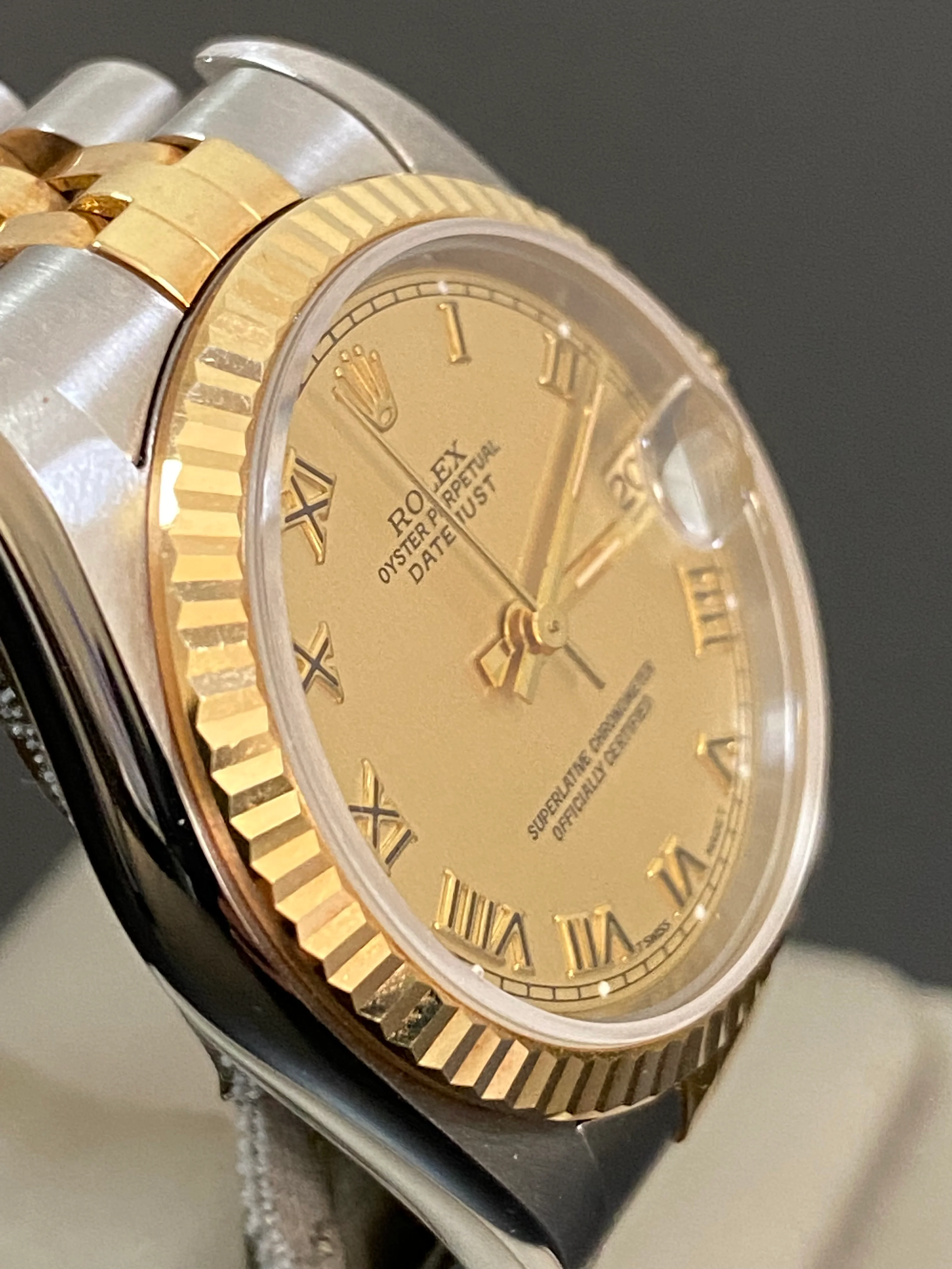 Rolex Steel and Yellow Gold Datejust 31 - S Serial - Fluted Bezel - Champagne Roman Dial - Jubilee Bracelet - 68273