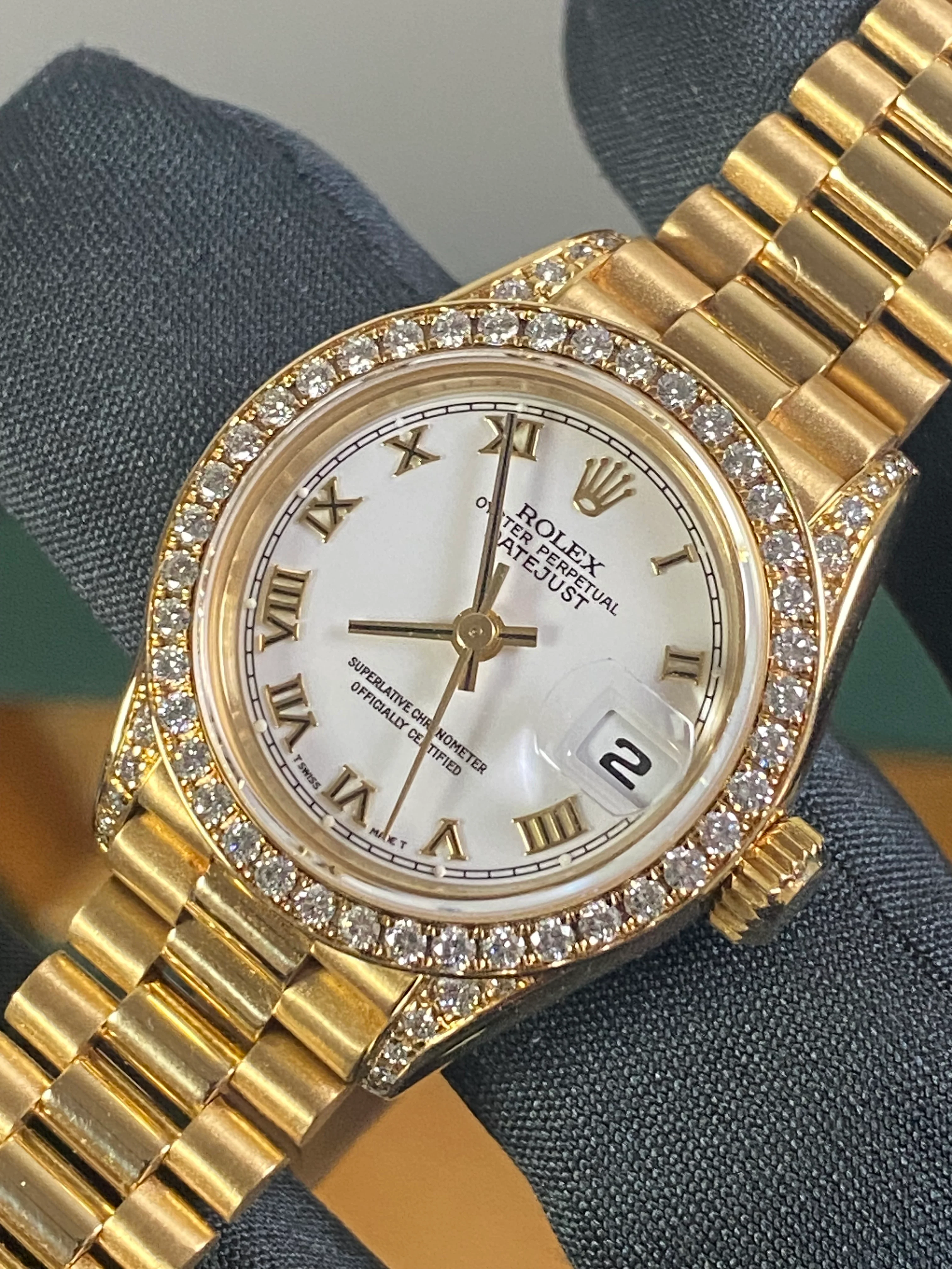 Rolex Yellow Gold Lady-Datejust - 1990 - Diamond Bezel - White Roman Dial - President Bracelet - 69158 