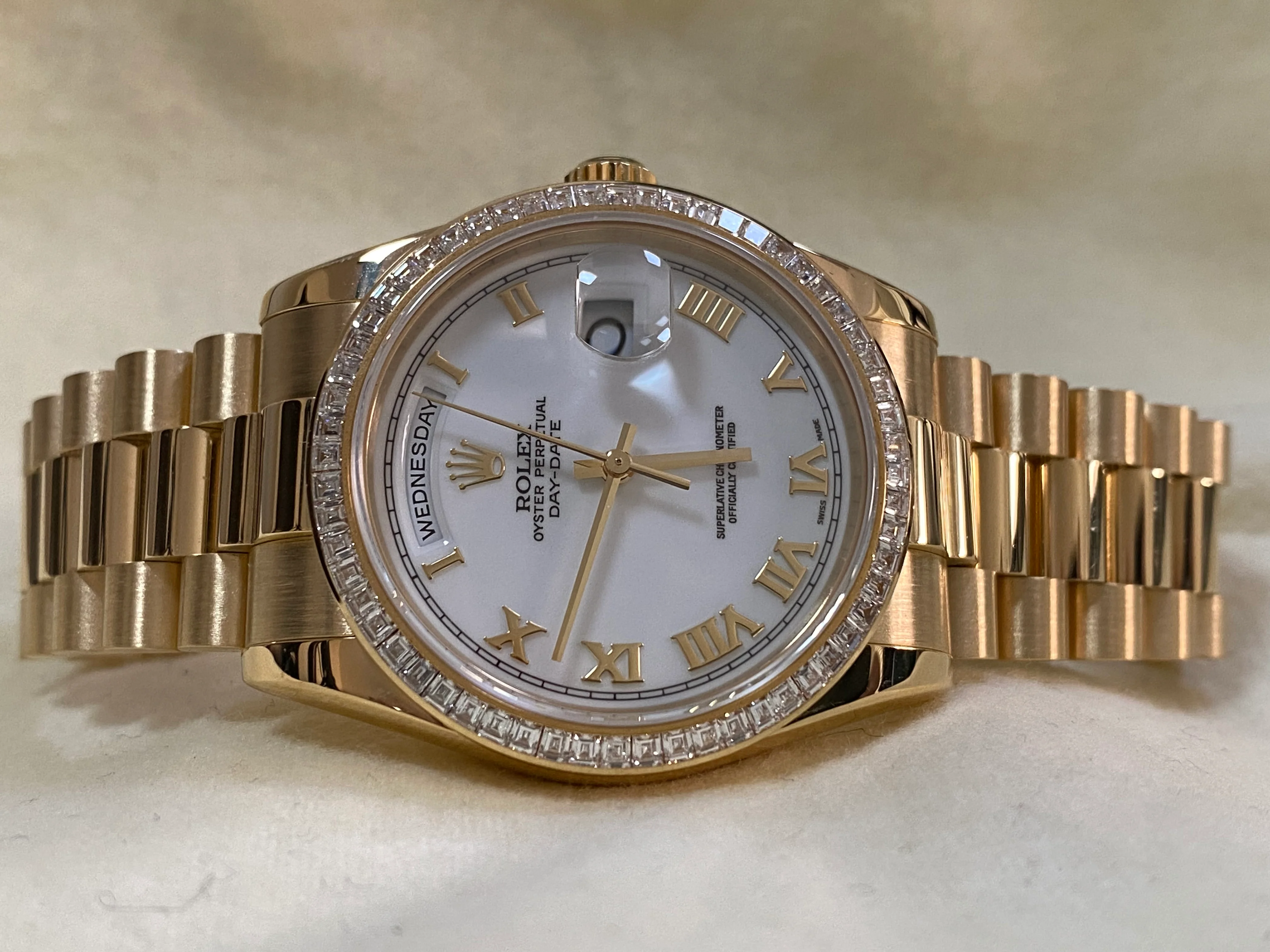 Rolex Yellow Gold Day-Date 36 - P Serial - Baguette Diamond Bezel - White Roman Dial - President Bracelet - 118398BR