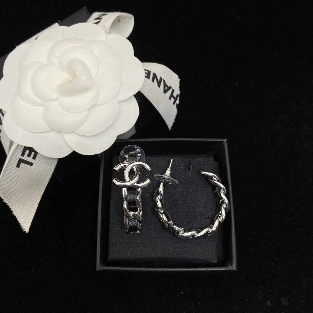 Chanel's  black hoop stud earrings