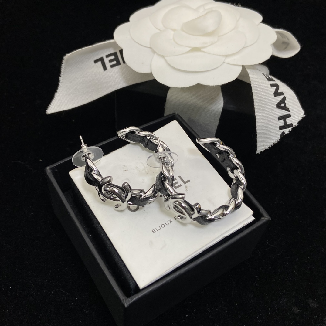 Chanel's  black hoop stud earrings