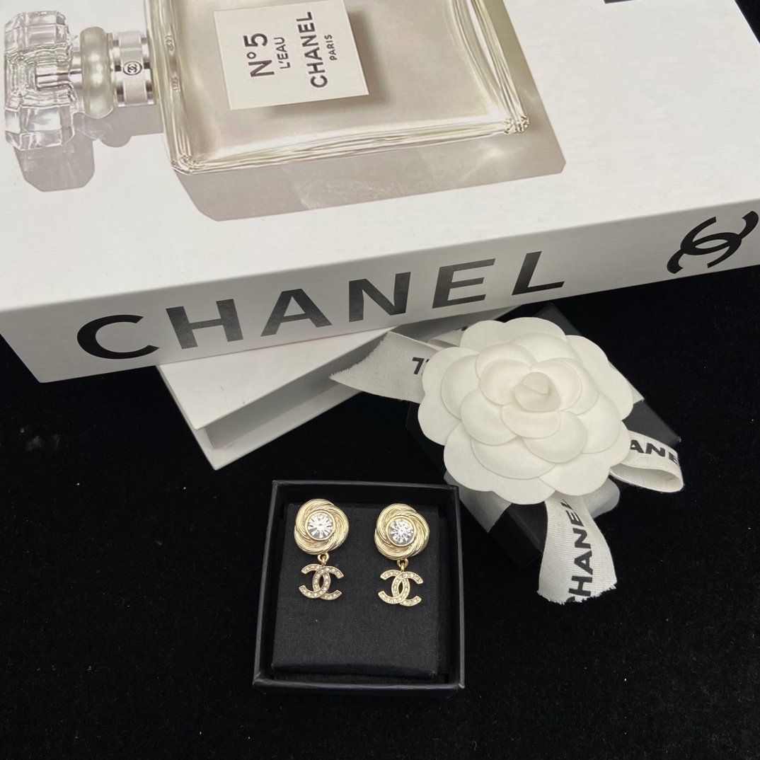 Chanel's round brushed round sparkling stud earrings