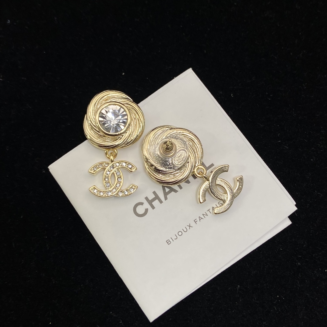 Chanel's round brushed round sparkling stud earrings