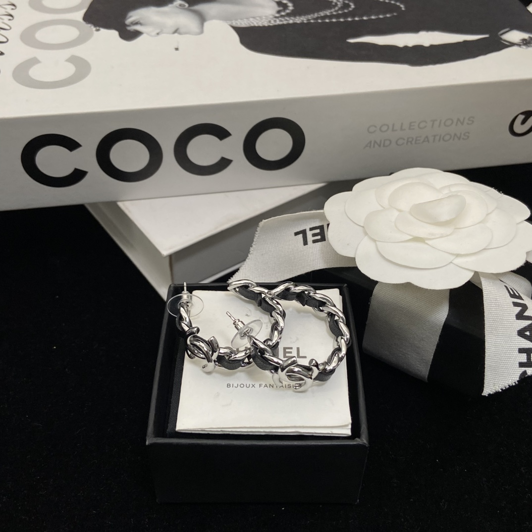 Chanel's  black hoop stud earrings