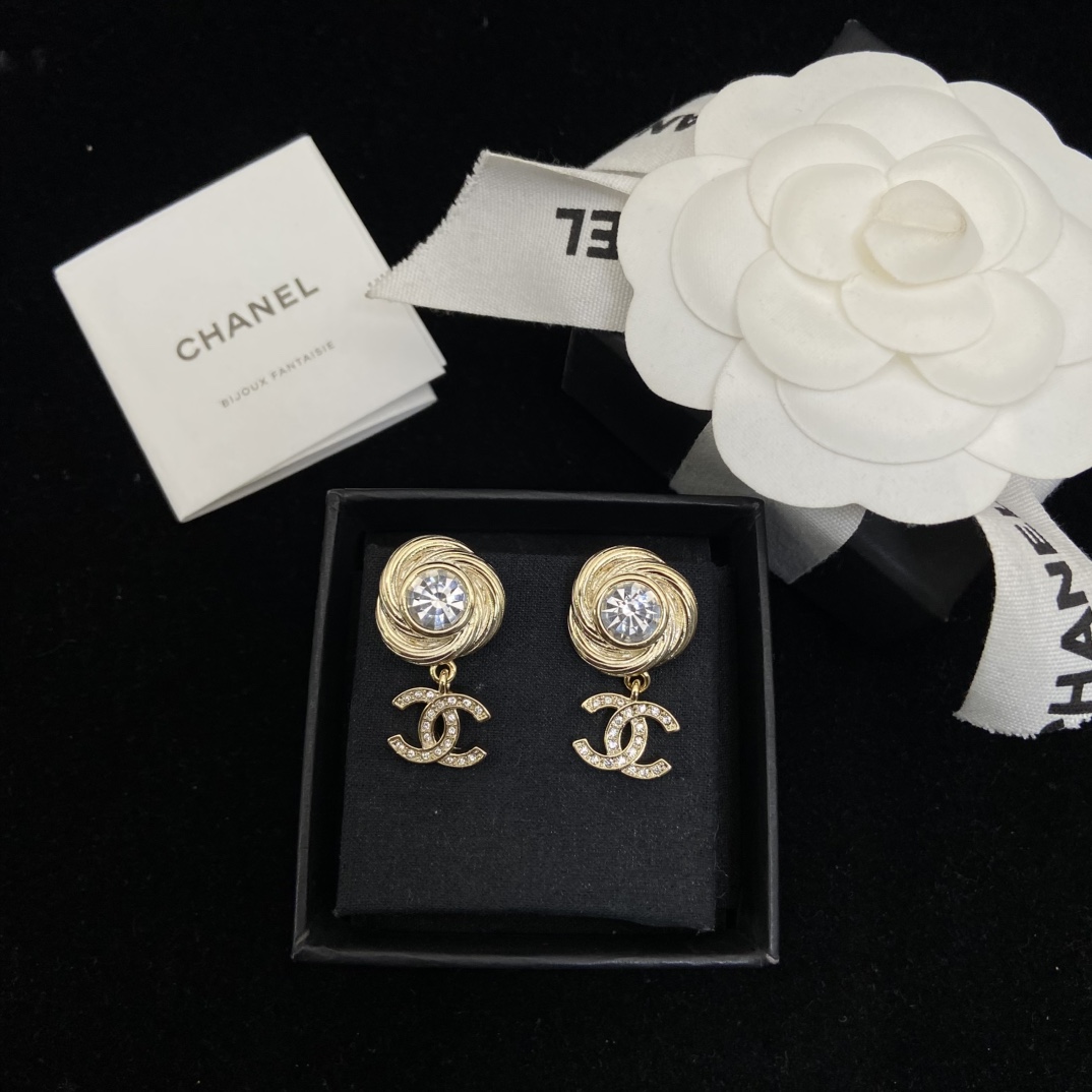 Chanel's round brushed round sparkling stud earrings