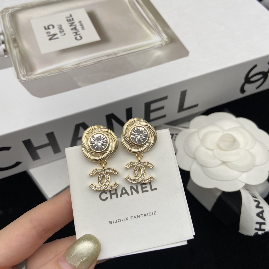 Chanel's round brushed round sparkling stud earrings