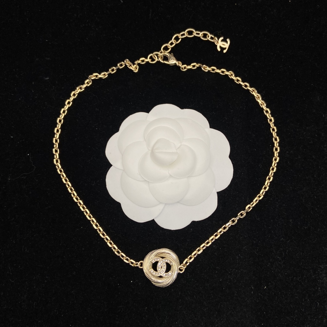 Chanel's new round brushed round necklace has a very vintage feel and a golden temperament