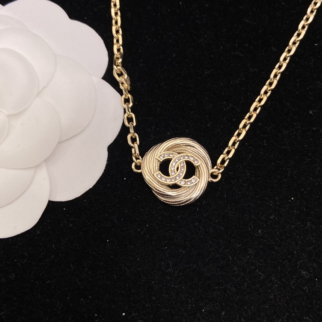 Chanel's new round brushed round necklace has a very vintage feel and a golden temperament