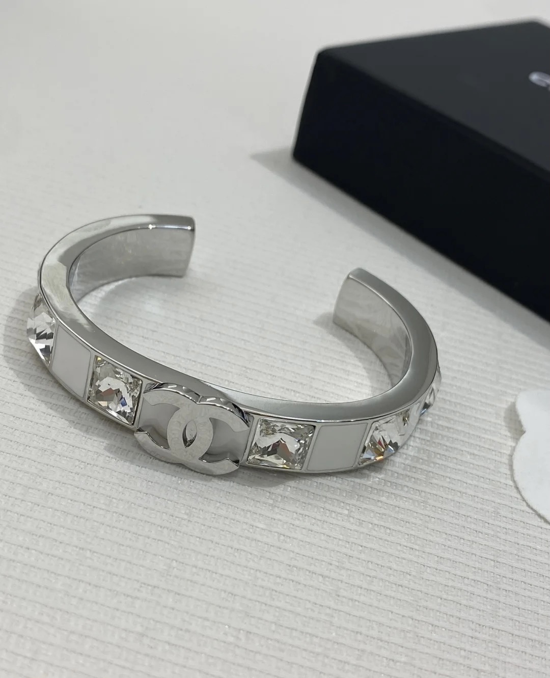 Chanel's new white enamel silver diamond cuff bracelet