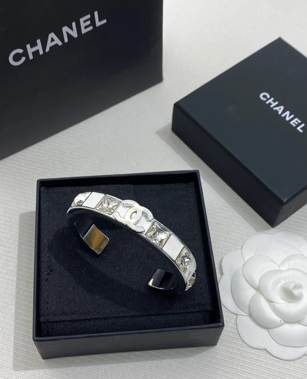 Chanel's new white enamel silver diamond cuff bracelet