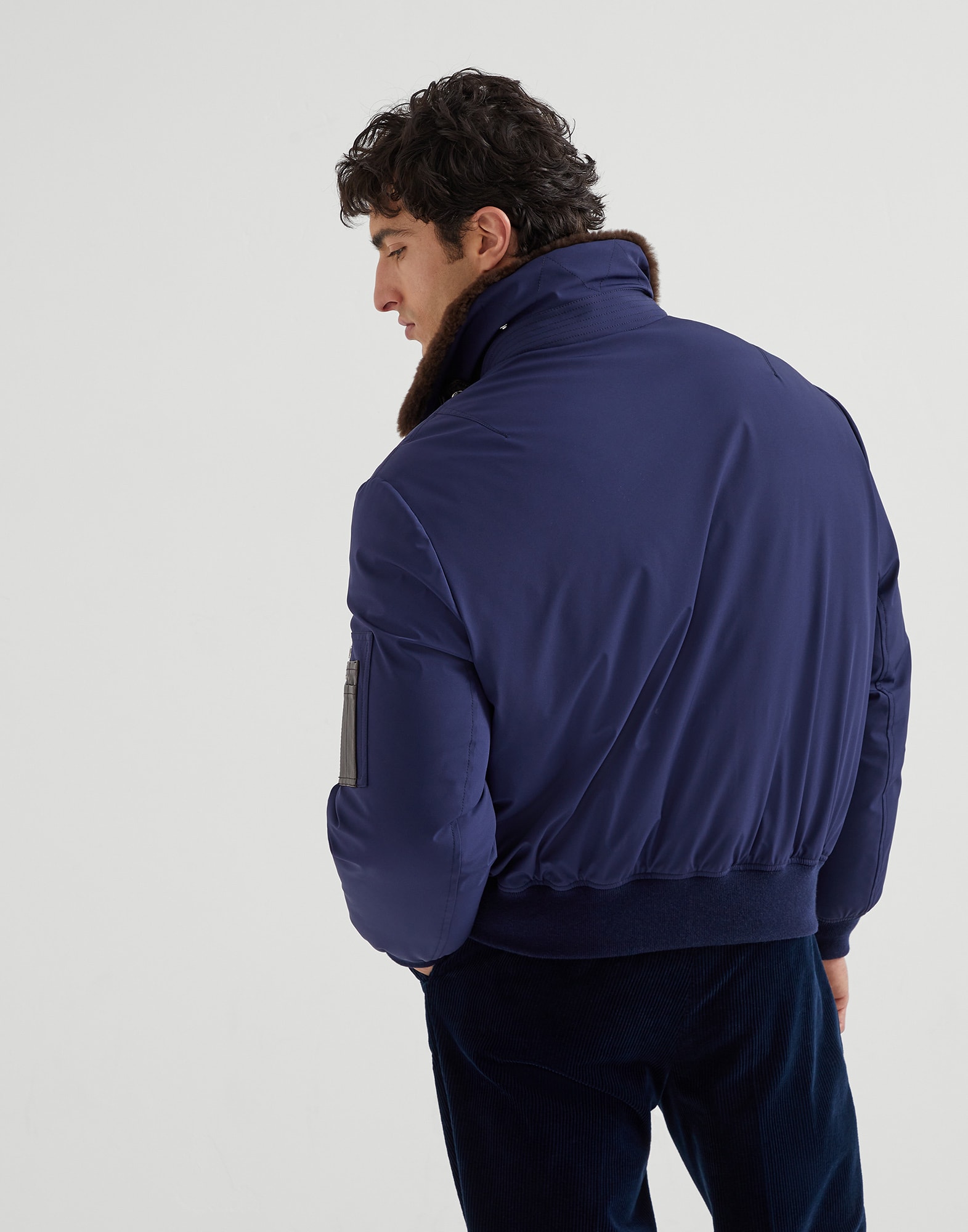 Stretch bonded nylon down jacket with shearling-lined collar