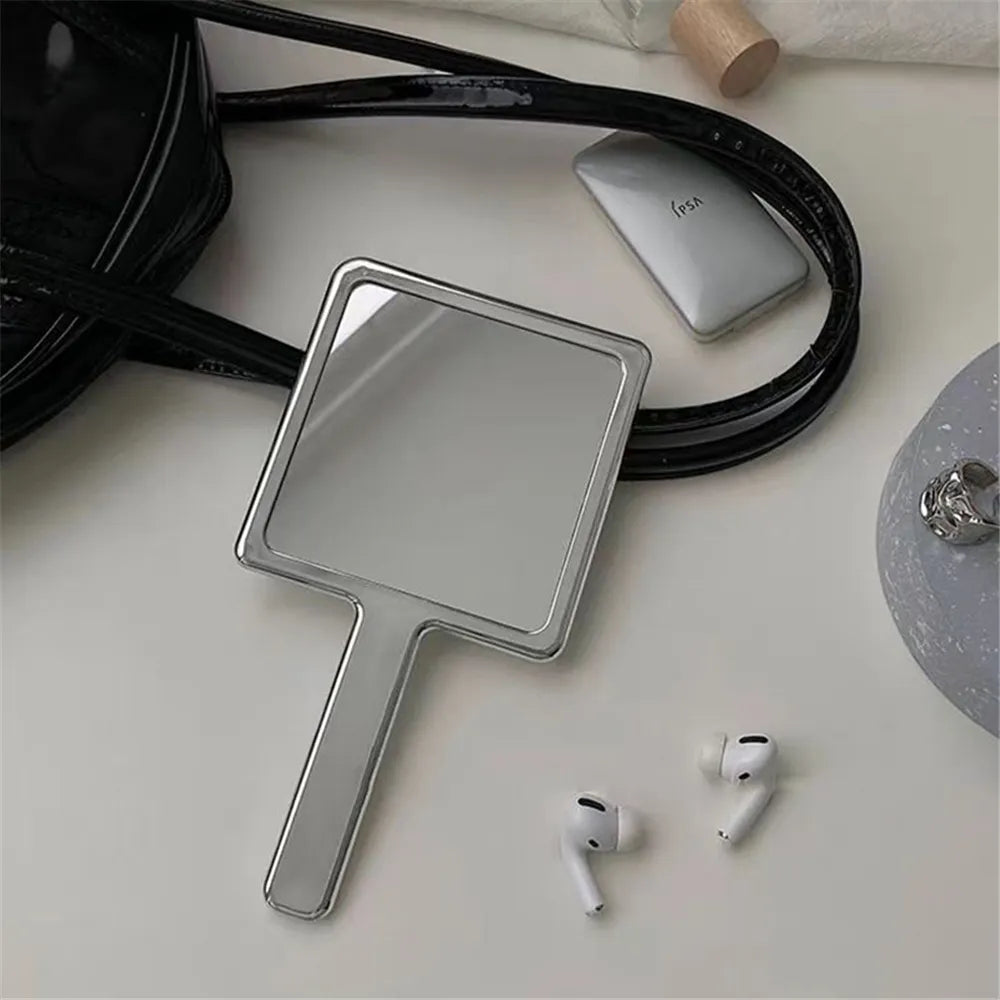 Aesthetic liquid Chrome handheld mirror