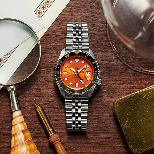 Men's automatic watch with orange dial, date calendar, luminous hands and markers, and grey GMT bezel, 100m water resistant