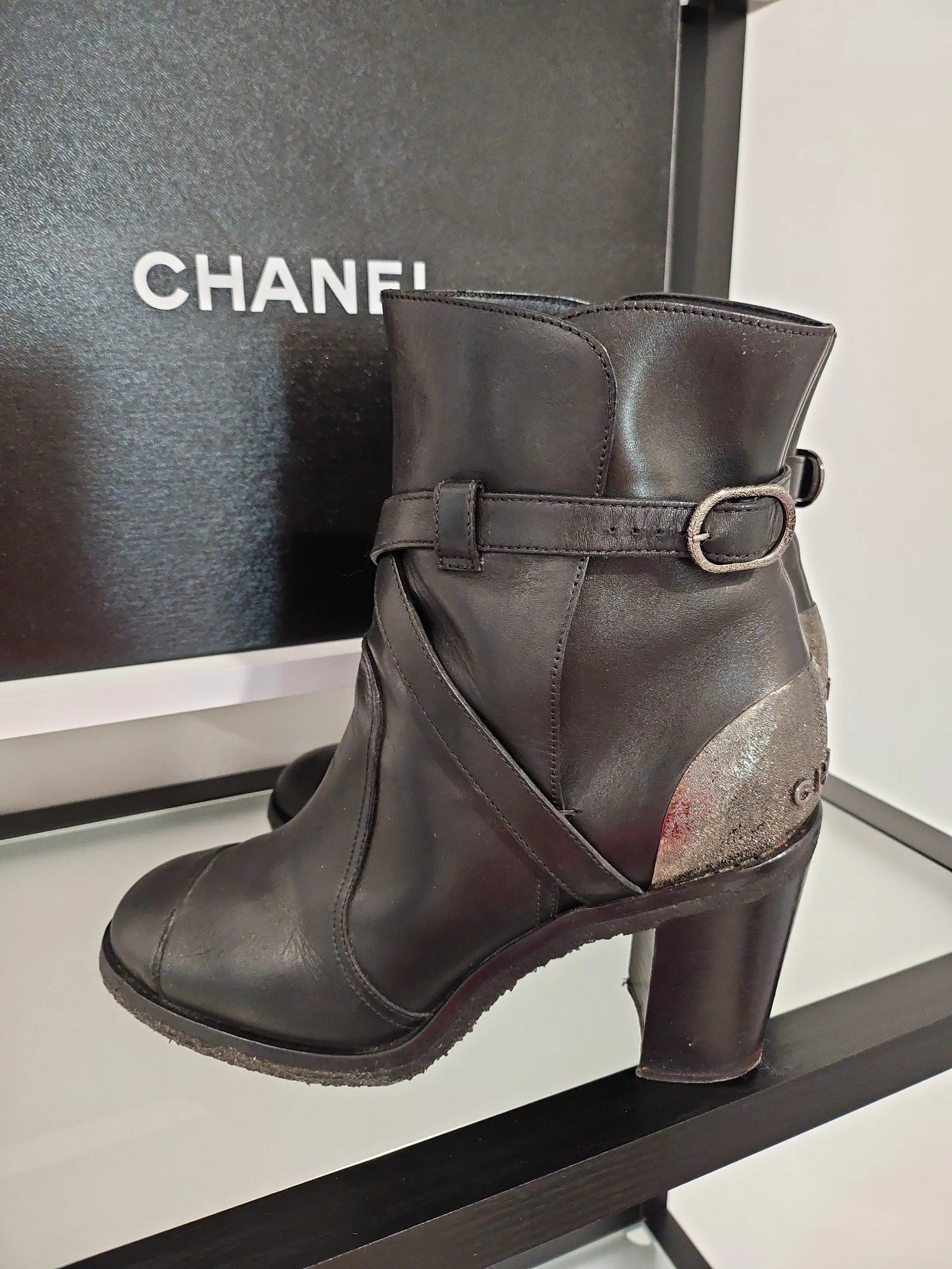 Chanel metal plaque runway boots