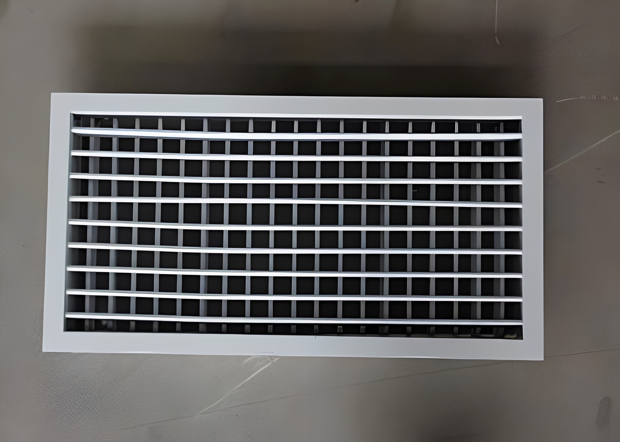 Double layered grille air outlet